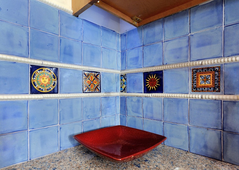 Inspiration for a small mediterranean u-shaped porcelain tile enclosed kitchen remodel in New York with a single-bowl sink, raised-panel cabinets, light wood cabinets, blue backsplash, ceramic backsplash, stainless steel appliances and recycled glass countertops