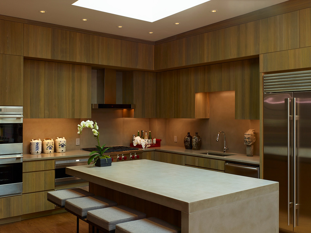 Esempio di una grande cucina contemporanea con lavello sottopiano, ante lisce, ante in legno scuro, elettrodomestici in acciaio inossidabile e pavimento in legno massello medio