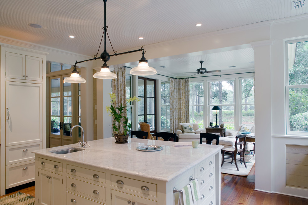 Elegant u-shaped open concept kitchen photo in Atlanta with an undermount sink, beaded inset cabinets, white cabinets and marble countertops