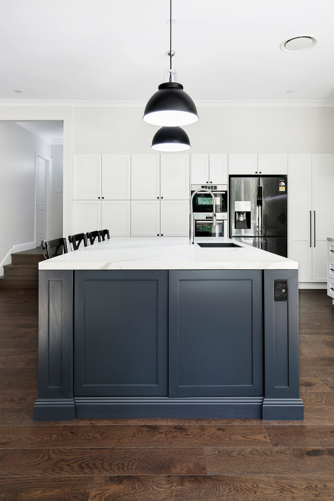 Design ideas for a large classic l-shaped open plan kitchen in Sydney with a submerged sink, shaker cabinets, black cabinets, tile countertops, multi-coloured splashback, ceramic splashback, stainless steel appliances, medium hardwood flooring, an island, brown floors and multicoloured worktops.