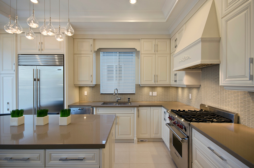 This is an example of a contemporary kitchen in Vancouver with stainless steel appliances.