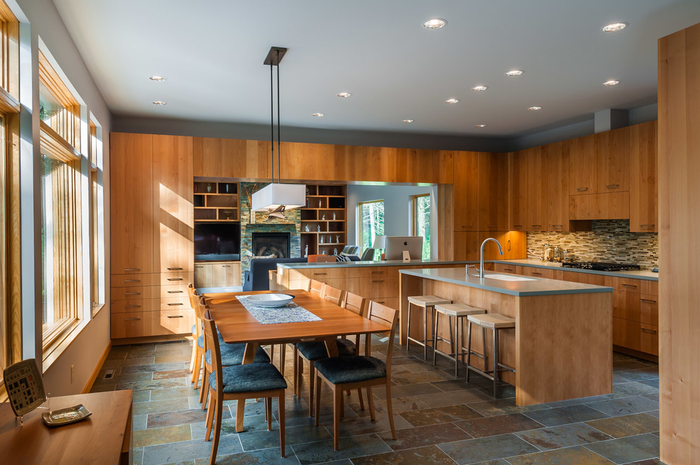 Example of a trendy l-shaped open concept kitchen design in Minneapolis with an undermount sink, flat-panel cabinets, medium tone wood cabinets, multicolored backsplash, mosaic tile backsplash and an island