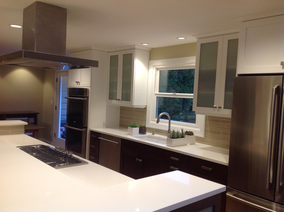 Example of a large trendy open concept kitchen design in Portland with an undermount sink, flat-panel cabinets, white cabinets, quartz countertops, brown backsplash, matchstick tile backsplash, stainless steel appliances and an island