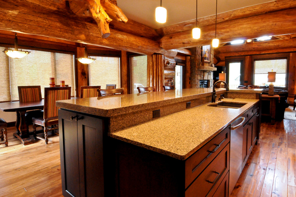 Example of a mid-sized mountain style l-shaped light wood floor eat-in kitchen design in Denver with an undermount sink, shaker cabinets, dark wood cabinets, granite countertops and an island
