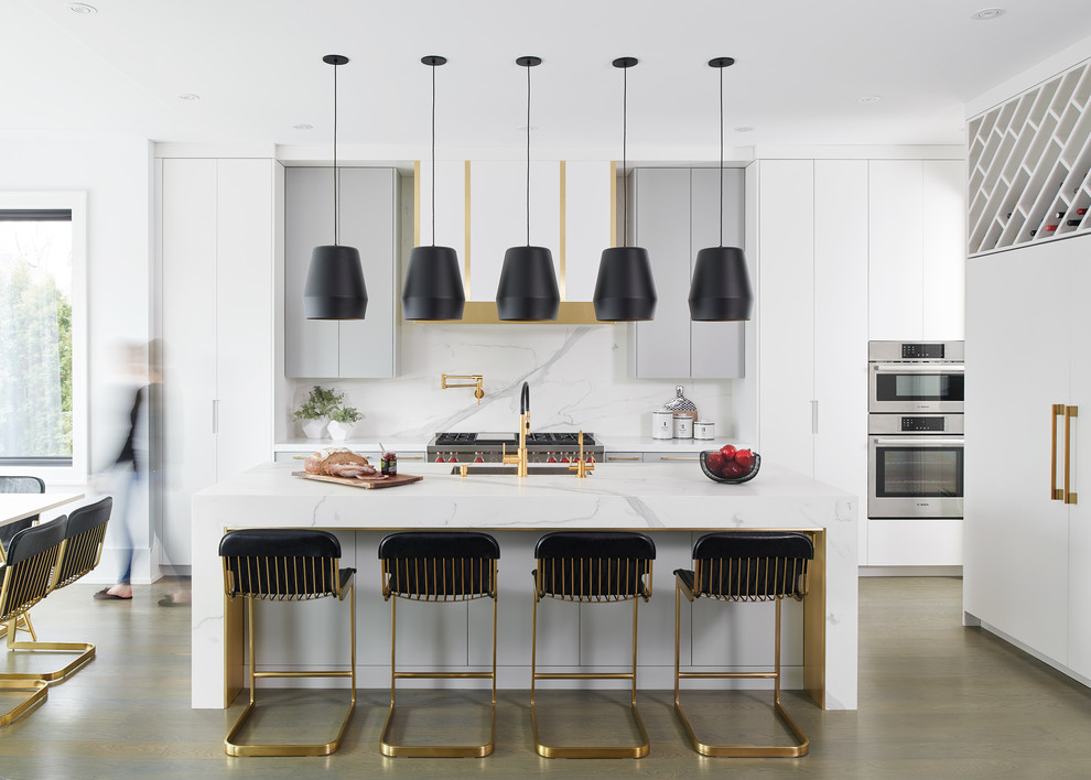 Inspiration for a contemporary kitchen/diner in Toronto with a submerged sink, flat-panel cabinets, white cabinets, white splashback, integrated appliances, dark hardwood flooring, an island, brown floors and white worktops.
