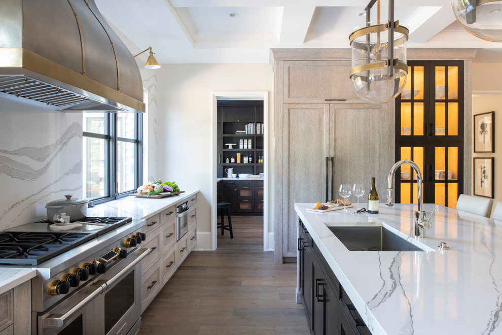 Photo of a medium sized rustic l-shaped kitchen pantry in Minneapolis with a single-bowl sink, flat-panel cabinets, brown cabinets, engineered stone countertops, black splashback, ceramic splashback, stainless steel appliances, medium hardwood flooring, no island, brown floors and brown worktops.