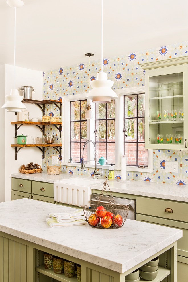 Kitchen - mid-sized farmhouse u-shaped dark wood floor kitchen idea in Los Angeles with shaker cabinets, green cabinets, marble countertops, porcelain backsplash, a farmhouse sink, stainless steel appliances, an island, multicolored backsplash and white countertops