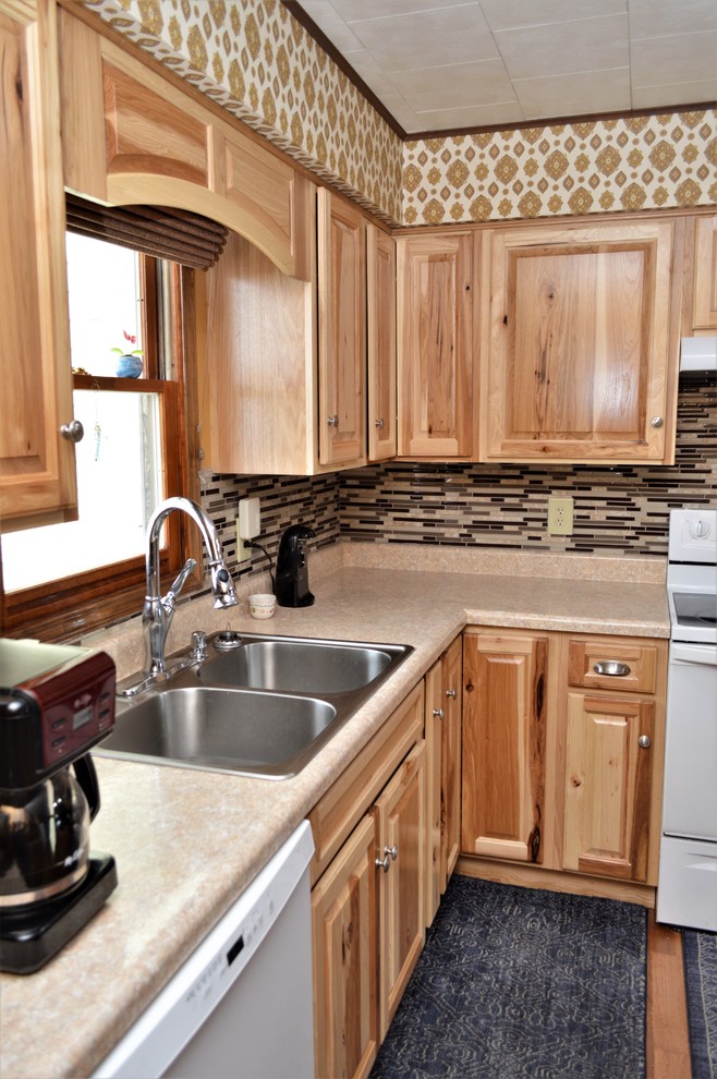 Example of a small arts and crafts l-shaped open concept kitchen design in Chicago with a drop-in sink, raised-panel cabinets, light wood cabinets, laminate countertops, multicolored backsplash, an island and beige countertops