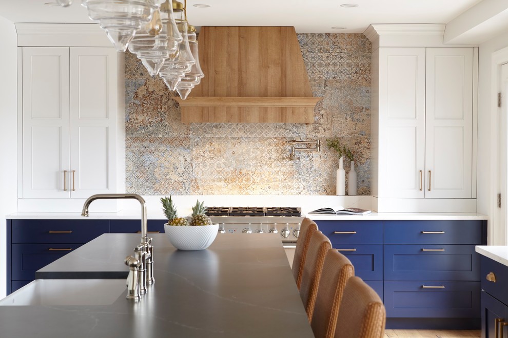 Example of a huge transitional u-shaped light wood floor and brown floor eat-in kitchen design in Toronto with an undermount sink, shaker cabinets, blue cabinets, quartz countertops, paneled appliances, an island and blue countertops
