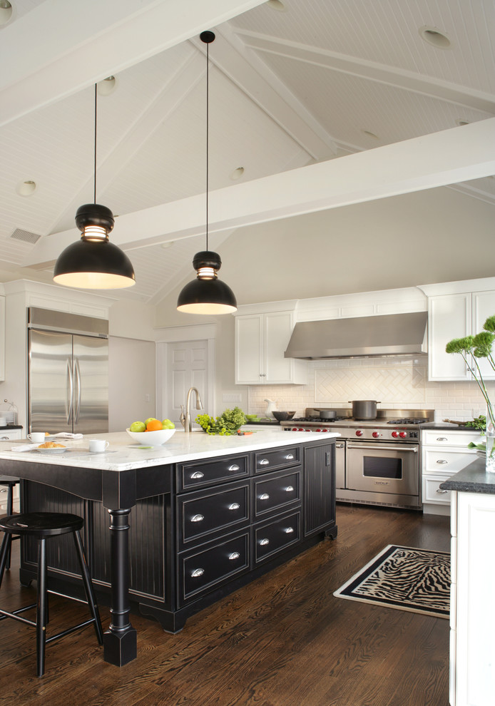Eat-in kitchen - large transitional u-shaped dark wood floor and brown floor eat-in kitchen idea in New York with recessed-panel cabinets, white backsplash, subway tile backsplash, stainless steel appliances, a single-bowl sink, marble countertops and an island