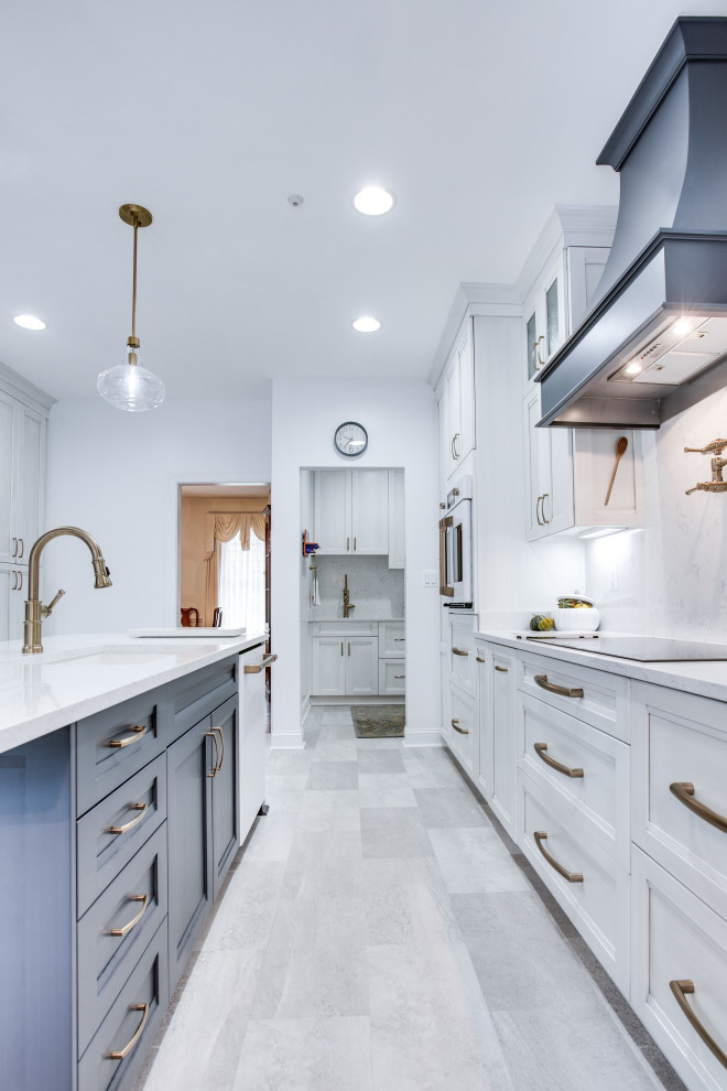 Inspiration for a large contemporary kitchen remodel in DC Metro with an undermount sink, quartz countertops, white appliances and an island