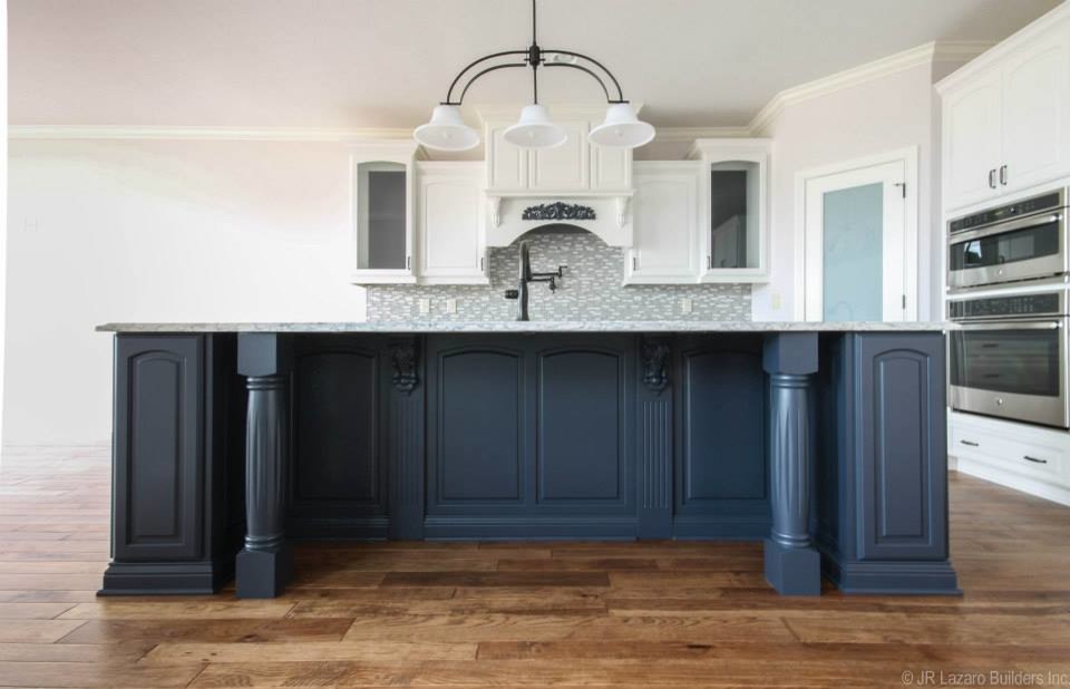Example of a mid-sized classic l-shaped eat-in kitchen design in Indianapolis with raised-panel cabinets, blue cabinets, stainless steel appliances and an island