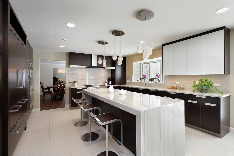 Photo of a contemporary kitchen in Chicago with flat-panel cabinets, dark wood cabinets, quartz worktops, stainless steel appliances and an island.