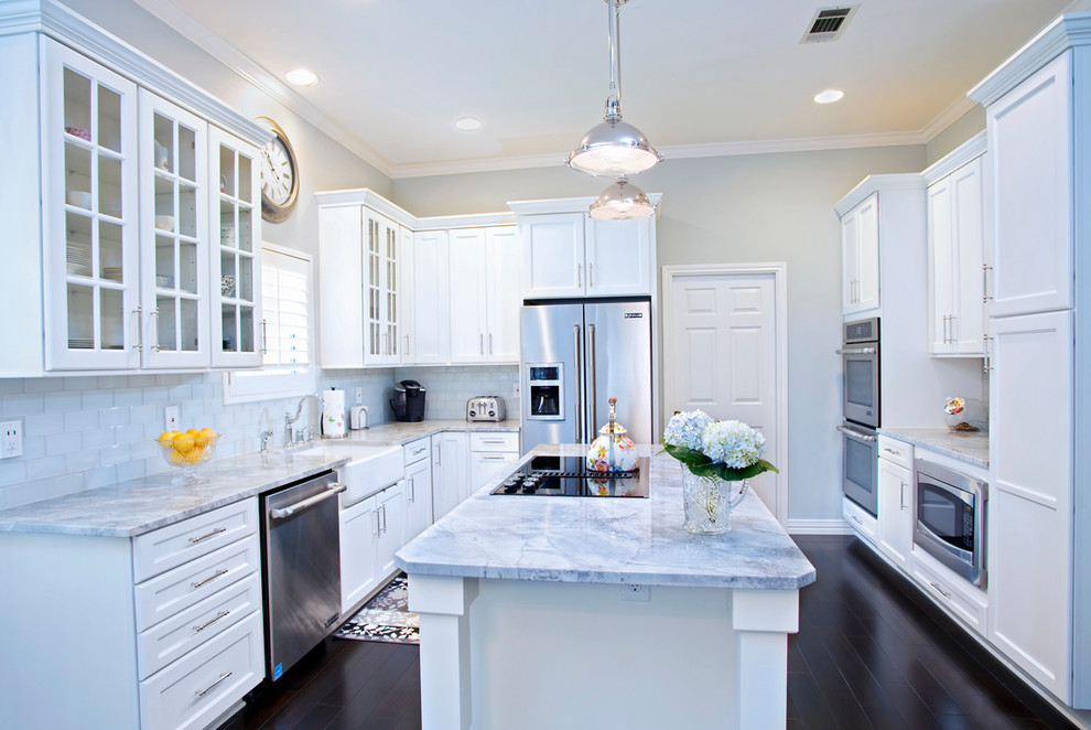 Kitchen - traditional kitchen idea in Austin with recessed-panel cabinets