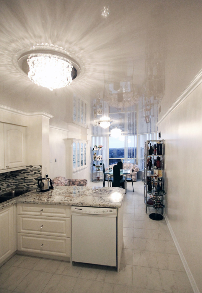 Example of a small trendy l-shaped marble floor open concept kitchen design in Toronto with a double-bowl sink, white cabinets, granite countertops, multicolored backsplash, ceramic backsplash, white appliances and a peninsula
