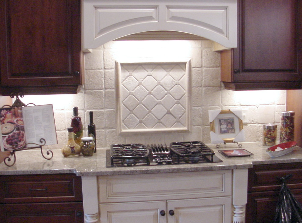 Elegant kitchen photo in Raleigh with white backsplash and stone tile backsplash