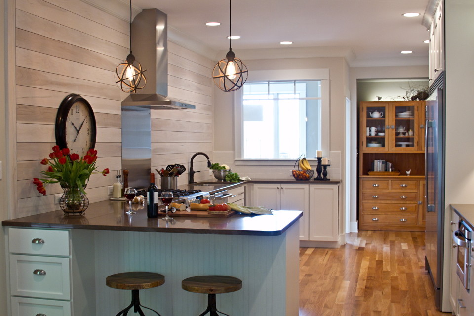 Kitchen - mid-sized transitional u-shaped medium tone wood floor and brown floor kitchen idea in Other with an undermount sink, shaker cabinets, blue cabinets, onyx countertops, gray backsplash, ceramic backsplash, stainless steel appliances and a peninsula