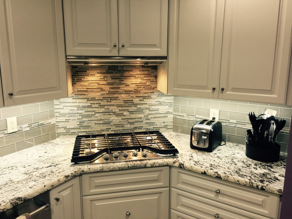White Kitchen Corner Cooktop Transitional Kitchen by The