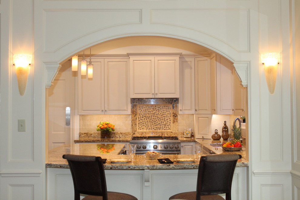 Example of a small classic kitchen design in Houston with white cabinets, multicolored backsplash and stainless steel appliances