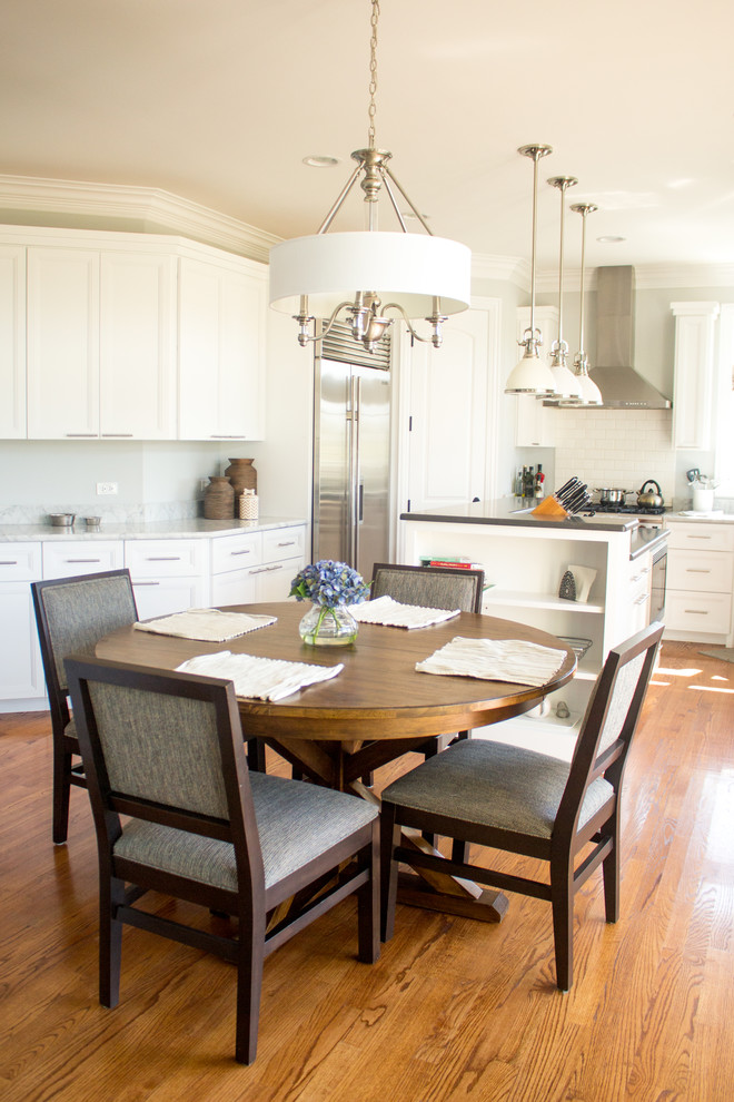 White Kitchen with Gray Marble Counters and Brown Kitchen Table