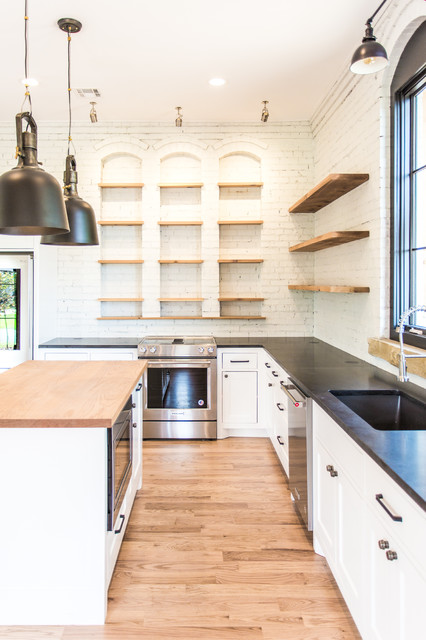 White Kitchen with Open Shelving, Black Honed Granite Countertops and