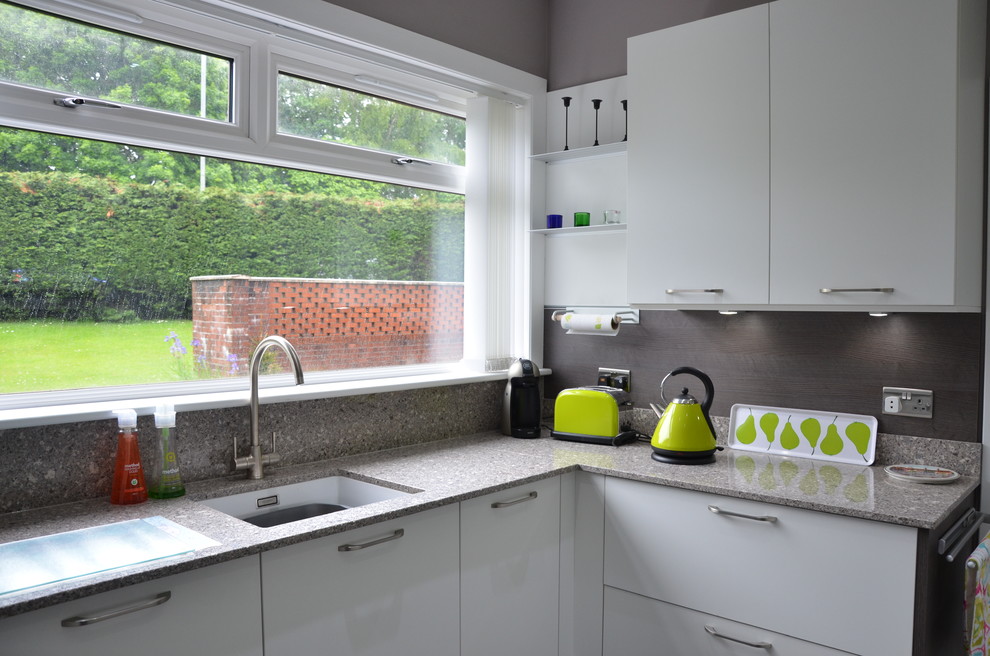 Inspiration for a medium sized contemporary u-shaped kitchen/diner in Glasgow with a double-bowl sink, open cabinets, grey cabinets, granite worktops, grey splashback, marble splashback, coloured appliances, medium hardwood flooring, no island and brown floors.