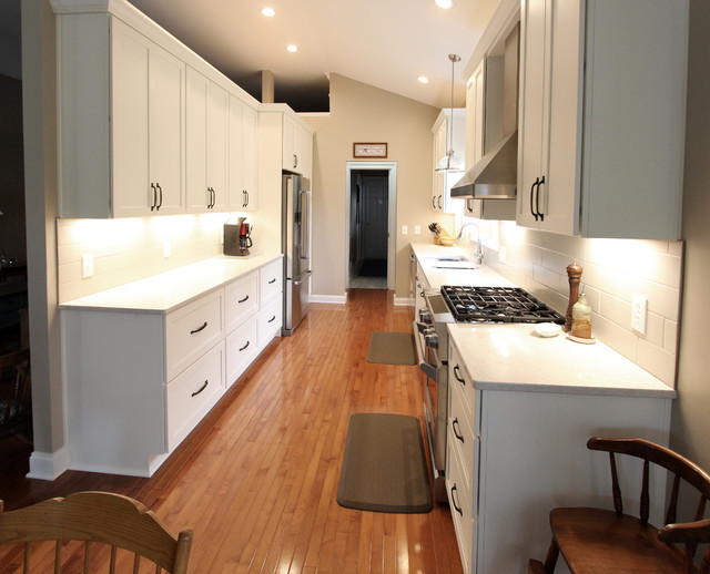 White Kitchen with Quartz Countertop, Galley Workstation and Large