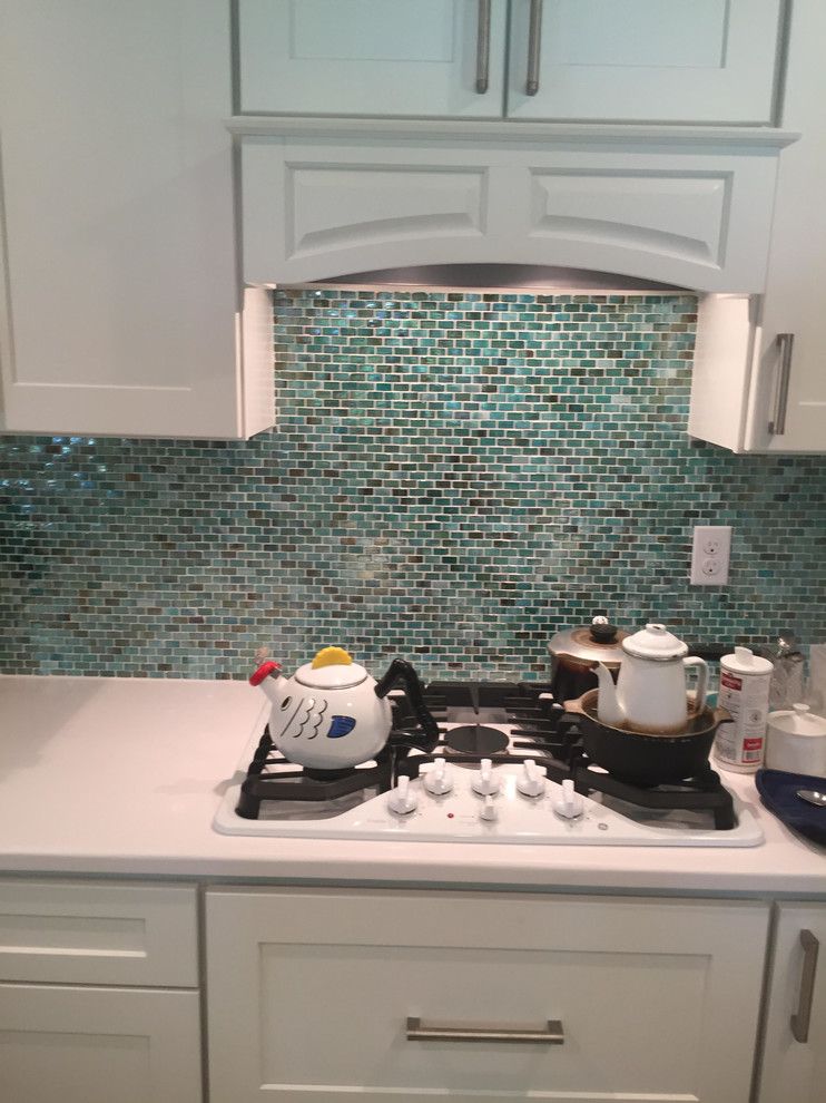 white kitchen teal backsplash