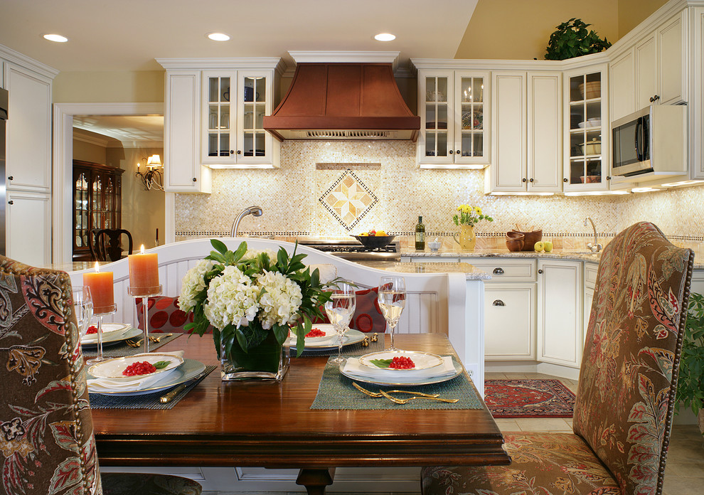 Eat-in kitchen - traditional eat-in kitchen idea in Newark with glass-front cabinets and white cabinets