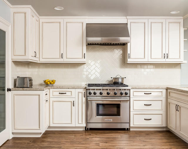 White Kitchen with Wolf Range Medium wood Floors Classique Chic