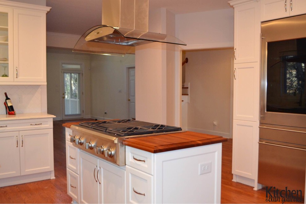 White Kitchen With Wood Island and Glass Door Refrigerator - Kitchen ...