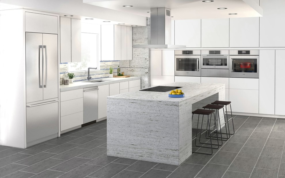 Large minimalist l-shaped concrete floor eat-in kitchen photo in Houston with an integrated sink, flat-panel cabinets, laminate countertops, mosaic tile backsplash, stainless steel appliances, an island, white cabinets and gray backsplash
