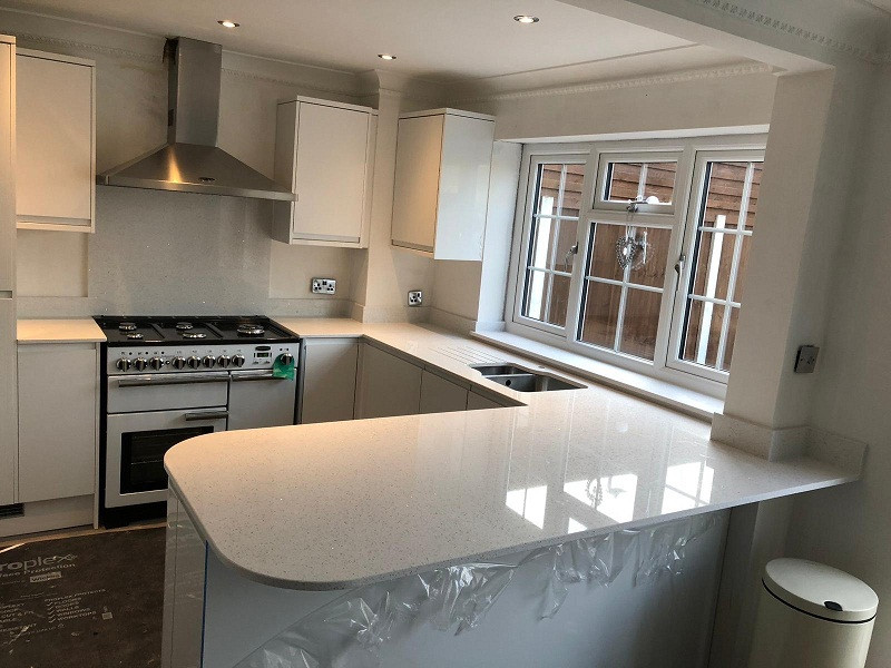 Photo of a rural kitchen in London with quartz worktops and white worktops.