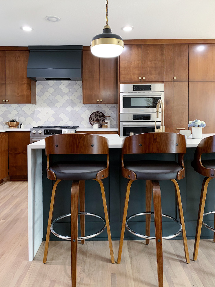 Large mid-century modern l-shaped dark wood floor and brown floor open concept kitchen photo in Minneapolis with a drop-in sink, flat-panel cabinets, dark wood cabinets, onyx countertops, white backsplash, ceramic backsplash, stainless steel appliances, an island and white countertops
