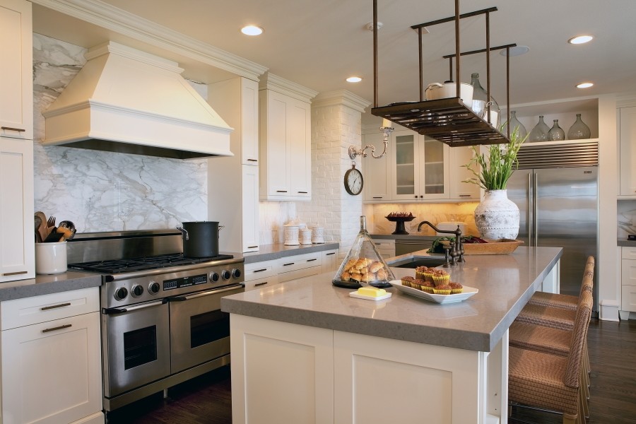Inspiration for a large modern l-shaped dark wood floor eat-in kitchen remodel in Orlando with an undermount sink, shaker cabinets, white cabinets, concrete countertops, gray backsplash, stone slab backsplash, stainless steel appliances and an island