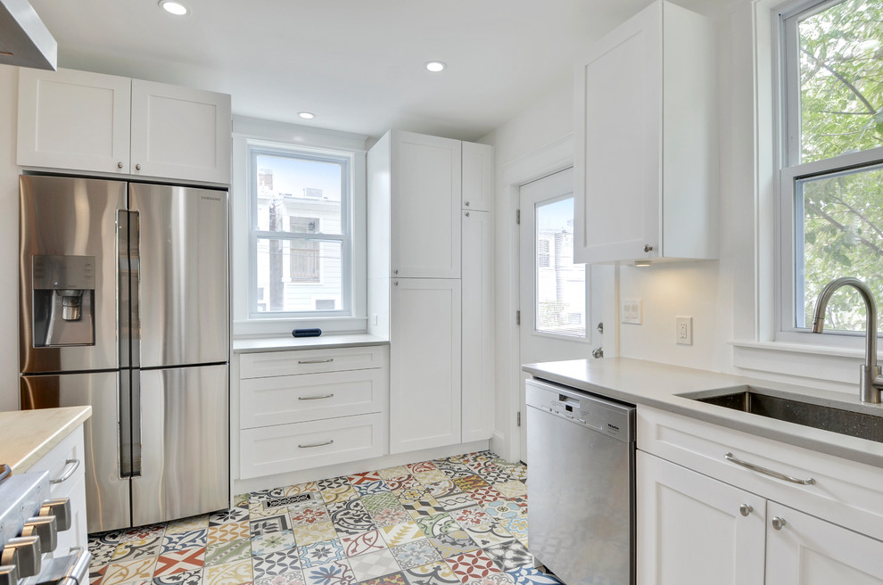 Enclosed kitchen - mid-sized modern u-shaped ceramic tile and multicolored floor enclosed kitchen idea in DC Metro with an undermount sink, shaker cabinets, white cabinets, granite countertops, stainless steel appliances, a peninsula and gray countertops