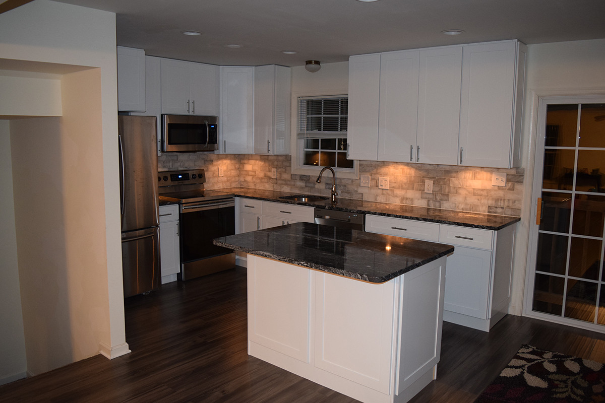 White Shaker Kitchen With New Dark Grey Laminate Flooring Transitional Kitchen Dc Metro By Nova Design And Build Houzz