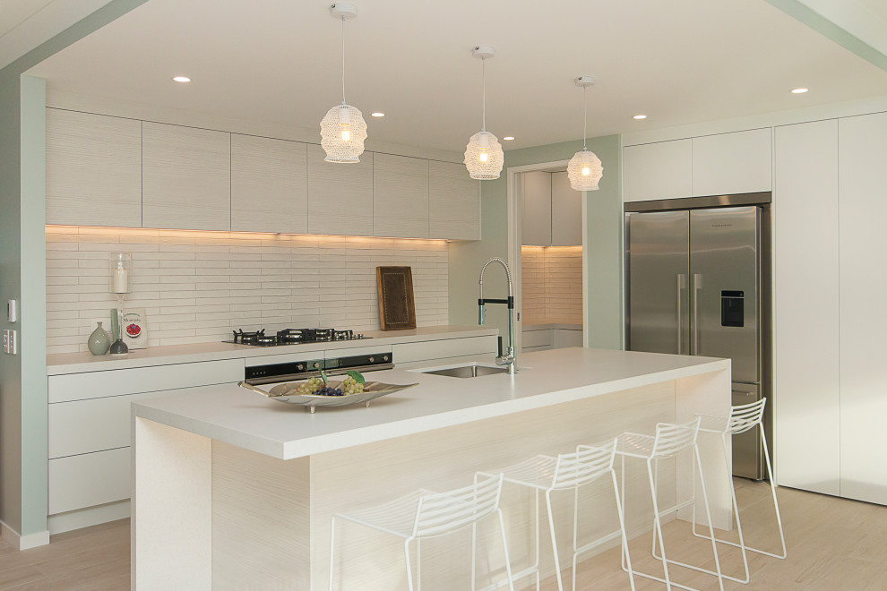This is an example of a coastal kitchen in Auckland.