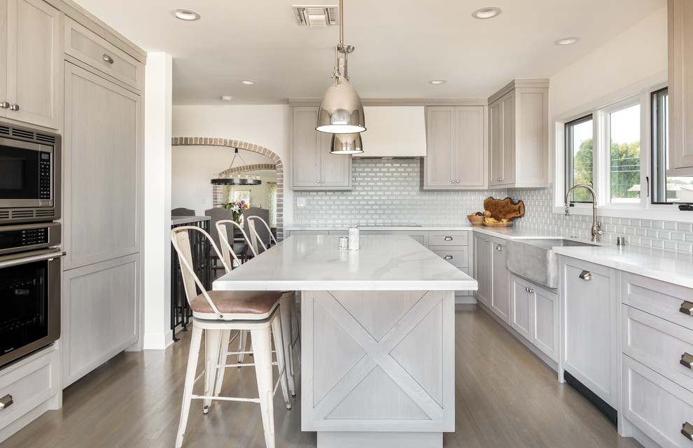 Inspiration for a country kitchen in Los Angeles with shaker cabinets, grey cabinets, engineered stone countertops, an island and grey worktops.