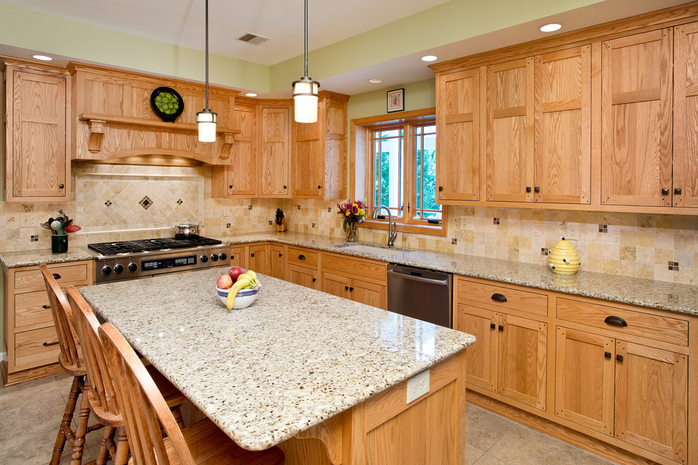 Large arts and crafts l-shaped limestone floor eat-in kitchen photo in Philadelphia with a single-bowl sink, shaker cabinets, medium tone wood cabinets, granite countertops, multicolored backsplash, porcelain backsplash, stainless steel appliances and an island