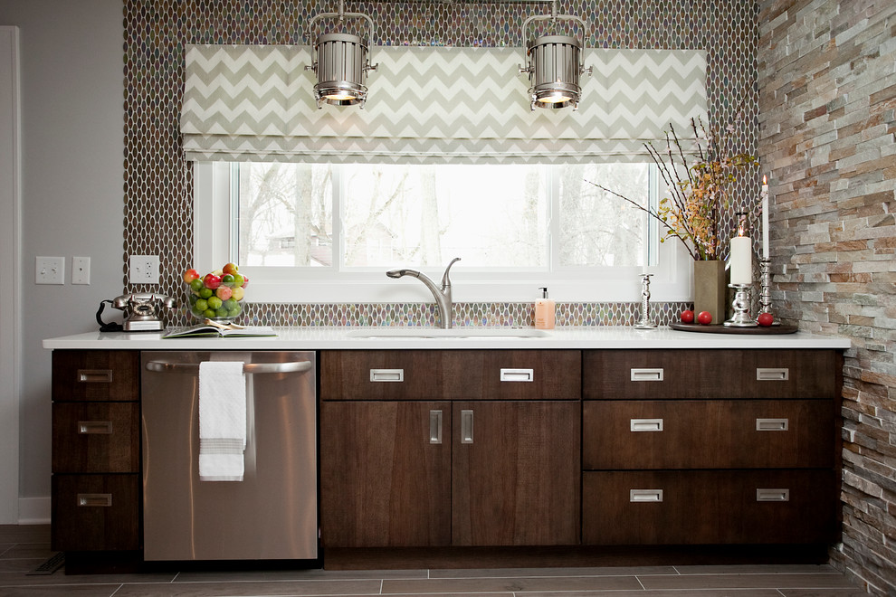 Kitchen - contemporary kitchen idea in Chicago with an undermount sink, flat-panel cabinets, dark wood cabinets, quartz countertops, metallic backsplash, mosaic tile backsplash and stainless steel appliances