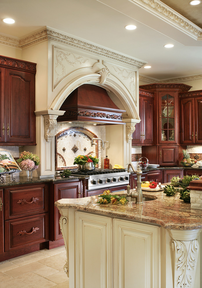 Example of a large classic l-shaped eat-in kitchen design in New York with an undermount sink, glass-front cabinets, medium tone wood cabinets, granite countertops, beige backsplash, stainless steel appliances and an island