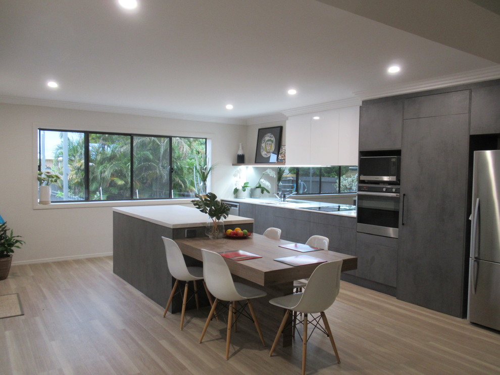 Example of a trendy kitchen design in Brisbane