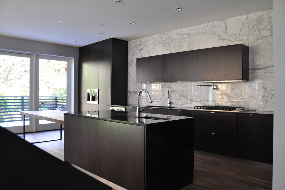 Example of a large minimalist l-shaped dark wood floor and brown floor eat-in kitchen design in Chicago with an undermount sink, flat-panel cabinets, brown cabinets, wood countertops, gray backsplash, stone slab backsplash, paneled appliances and an island