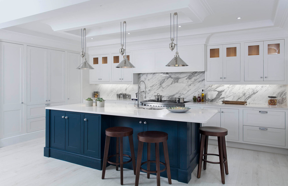Mid-sized transitional l-shaped light wood floor and white floor open concept kitchen photo in Other with an undermount sink, shaker cabinets, gray cabinets, quartzite countertops, gray backsplash, marble backsplash, stainless steel appliances and an island