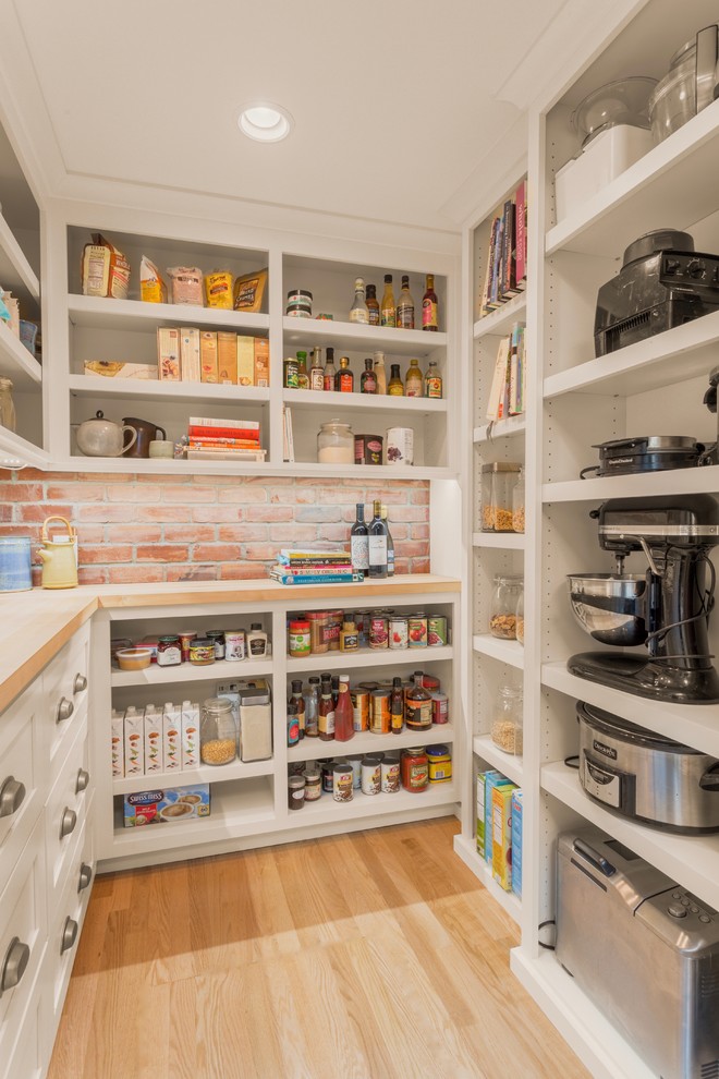Transitional u-shaped light wood floor and beige floor kitchen pantry photo in Seattle with open cabinets, white cabinets, brick backsplash and no island