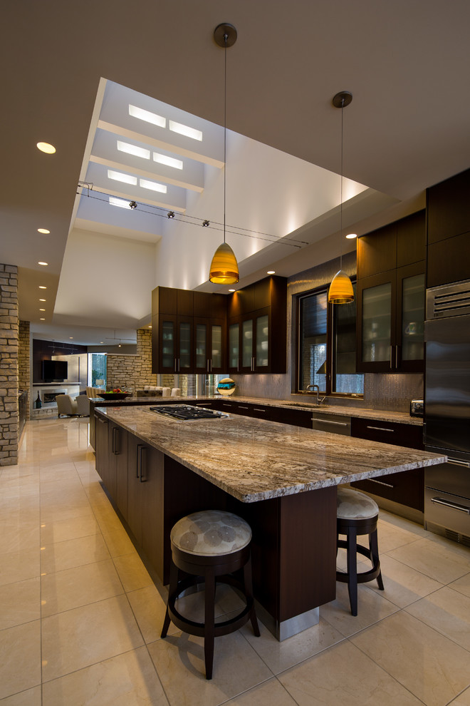Mid-sized minimalist l-shaped porcelain tile eat-in kitchen photo in Other with a single-bowl sink, flat-panel cabinets, dark wood cabinets, granite countertops, metallic backsplash, porcelain backsplash, stainless steel appliances and an island