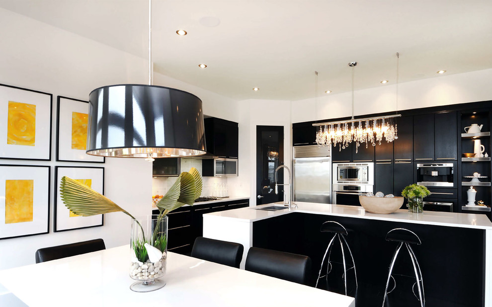 Example of a trendy eat-in kitchen design in Other with stainless steel appliances, an undermount sink and flat-panel cabinets