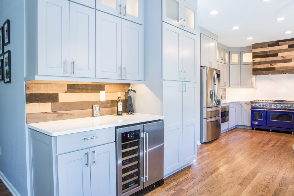 Photo of an expansive classic u-shaped kitchen/diner in Denver with shaker cabinets, grey cabinets, engineered stone countertops, blue splashback, no island and white worktops.