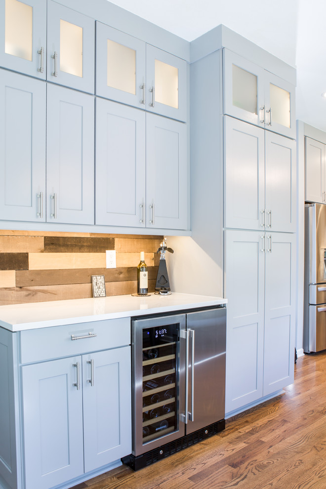 Inspiration for a huge transitional u-shaped eat-in kitchen remodel in Denver with shaker cabinets, gray cabinets, quartz countertops, blue backsplash, no island and white countertops